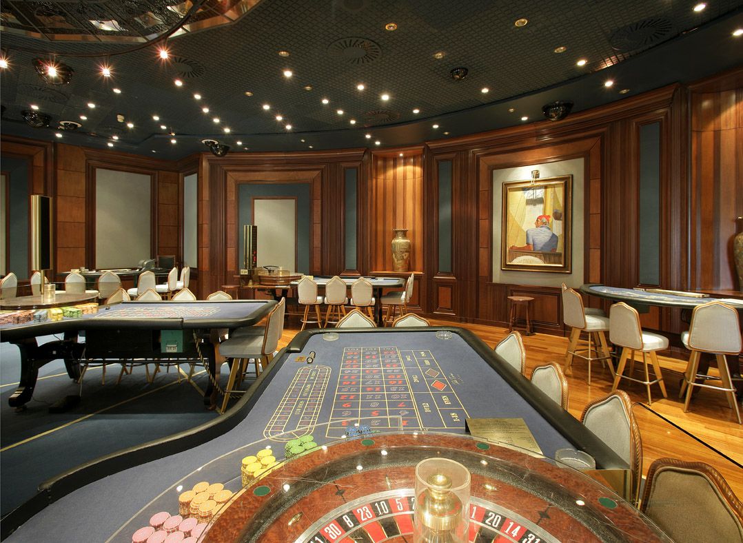 Private casino salon with roulette and card tables